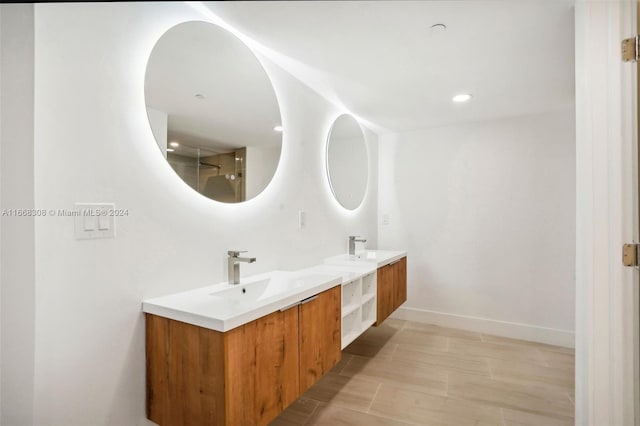 bathroom with vanity and hardwood / wood-style flooring