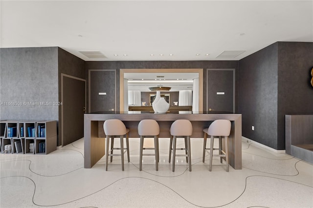 kitchen with a breakfast bar area