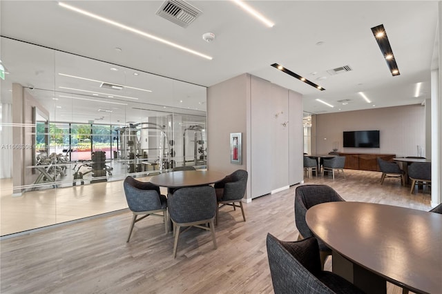 dining area with light hardwood / wood-style floors