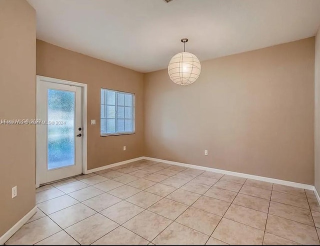 spare room with light tile patterned floors