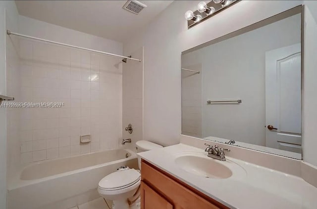 full bathroom featuring vanity, toilet, tile patterned floors, and tiled shower / bath