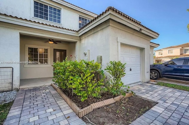 exterior space featuring ceiling fan