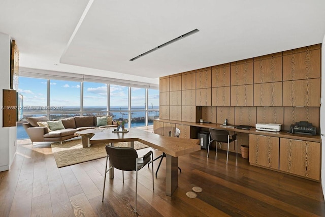 450 Alton Rd Unit Ph2, Miami Beach, FL 33139 - living room with floor to ceiling windows, wood finished floors, a water view, and an office area