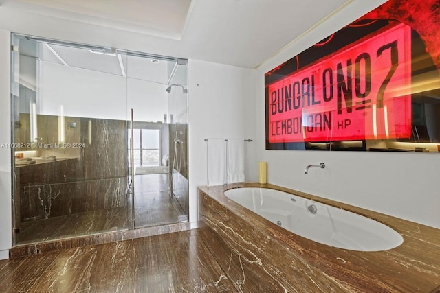 bathroom featuring separate shower and tub and hardwood / wood-style floors