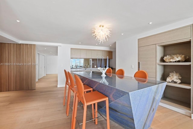 450 Alton Rd Unit Ph2, Miami Beach, FL 33139 - dining room with light wood-style flooring, a chandelier, and recessed lighting