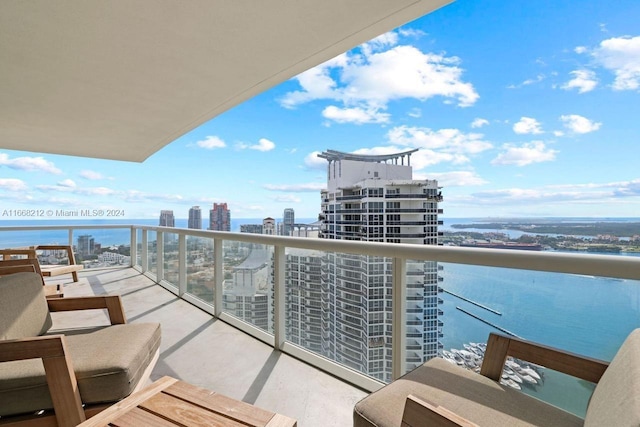 balcony featuring a water view