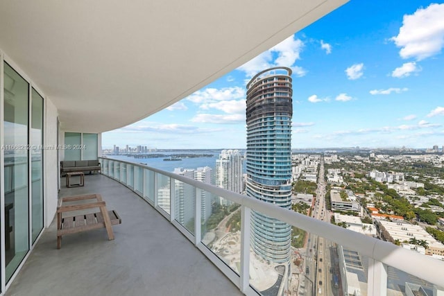 balcony featuring a water view