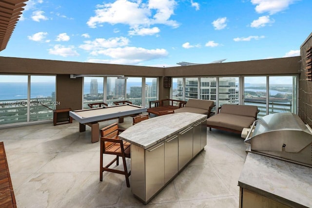 450 Alton Rd Unit Ph2, Miami Beach, FL 33139 - view of patio with area for grilling and a water view