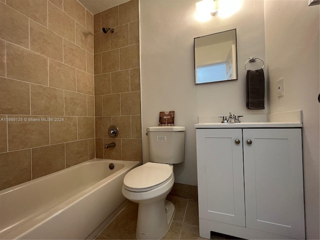 full bathroom featuring vanity, toilet, baseboards, tile patterned floors, and shower / washtub combination