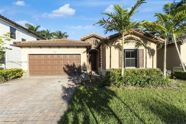 mediterranean / spanish-style home featuring a garage