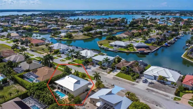 birds eye view of property with a water view