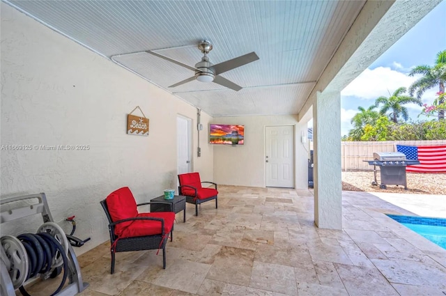 view of patio featuring a grill and ceiling fan