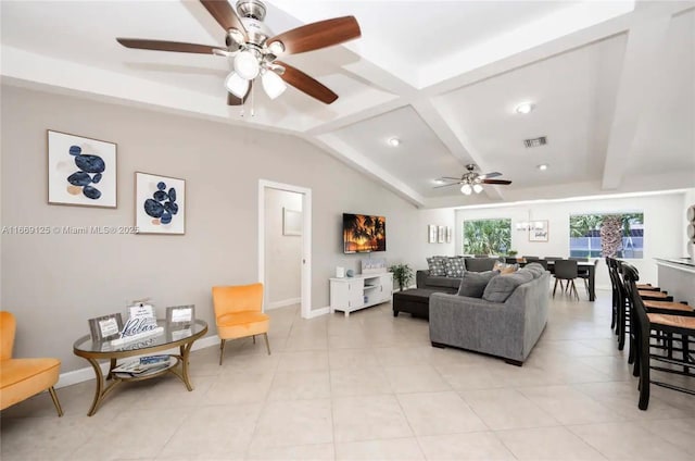 tiled living room featuring lofted ceiling with beams