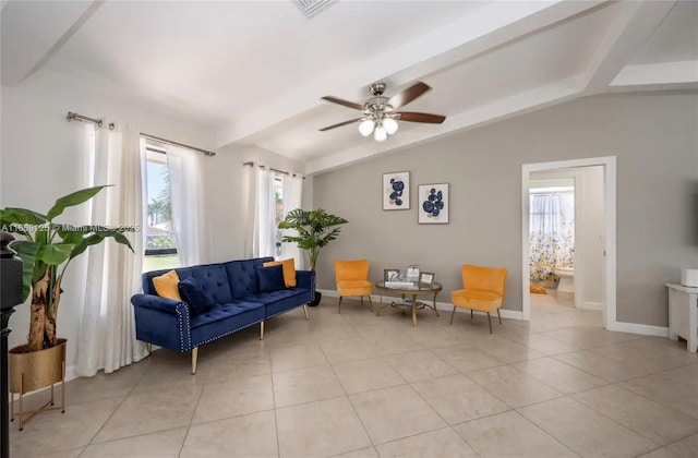 sitting room with ceiling fan, lofted ceiling, and light tile patterned floors