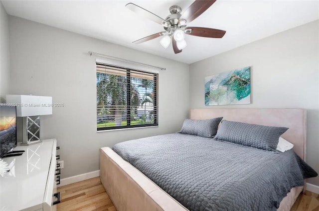 bedroom featuring ceiling fan and light hardwood / wood-style floors