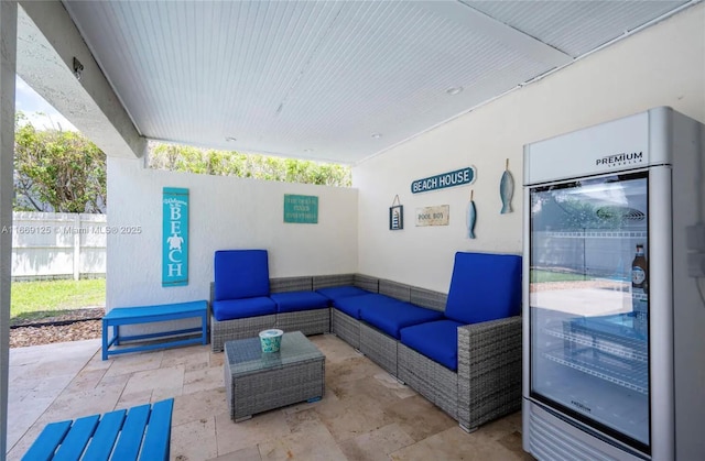 view of patio featuring an outdoor living space and beverage cooler