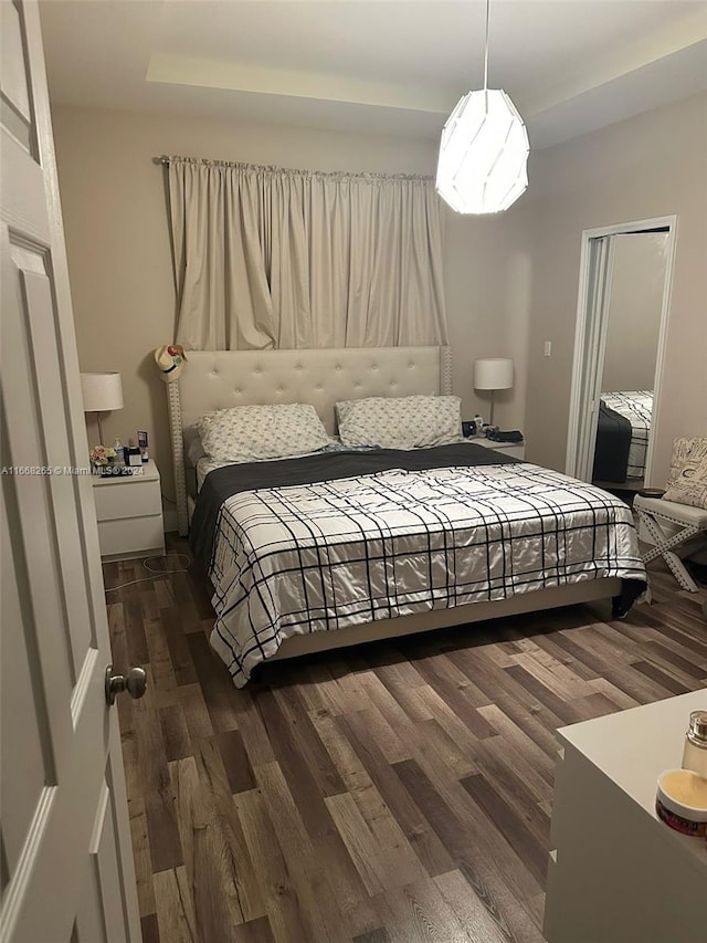 bedroom featuring dark hardwood / wood-style floors