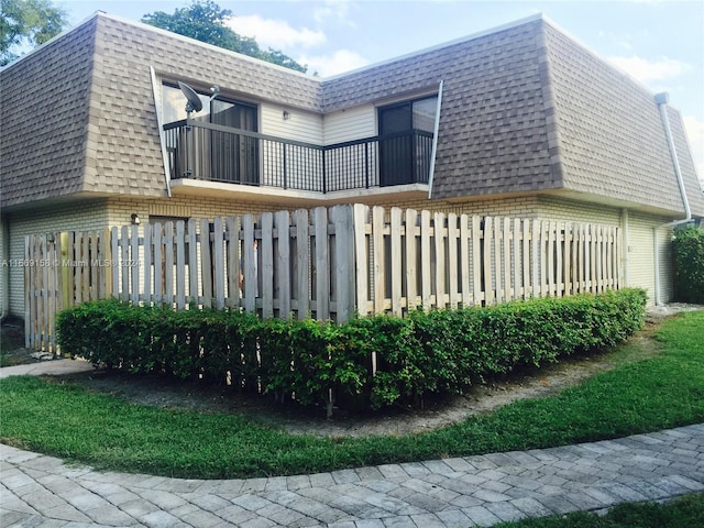 view of home's exterior featuring a balcony