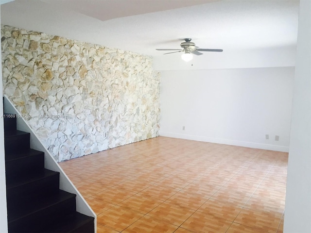 interior space featuring ceiling fan