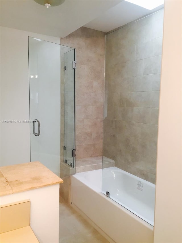 bathroom with shower with separate bathtub