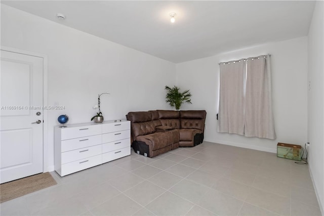 sitting room featuring light tile patterned flooring