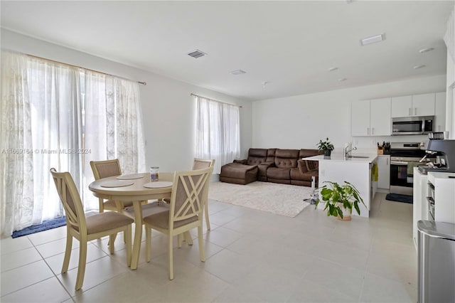 tiled dining space with sink