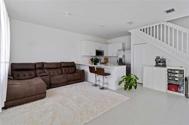 living room featuring light tile patterned flooring