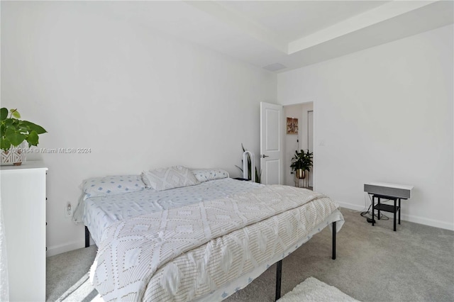 bedroom featuring light colored carpet