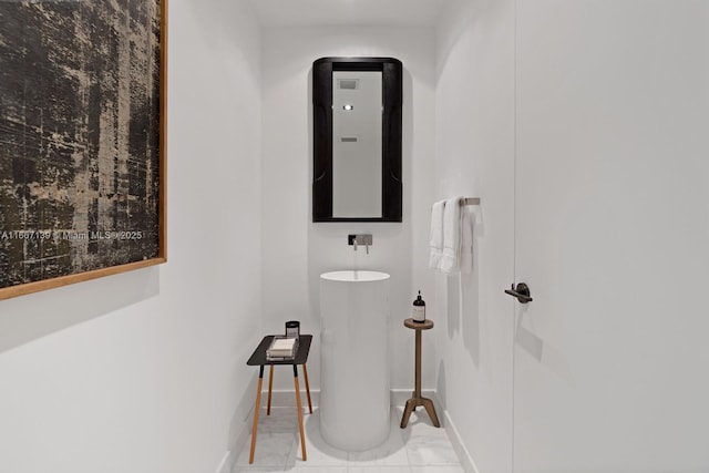 bathroom with tile patterned flooring