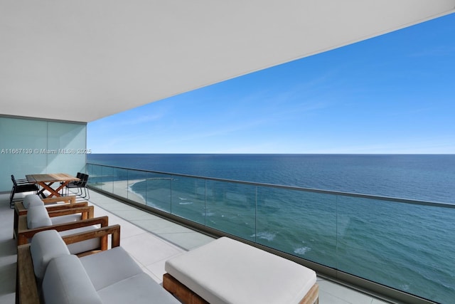 balcony featuring a water view