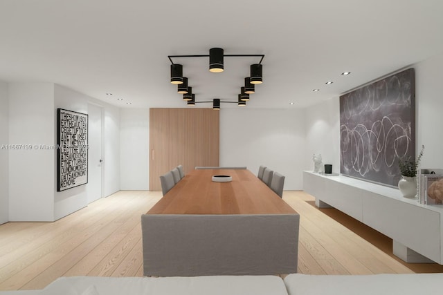 dining space with light hardwood / wood-style flooring