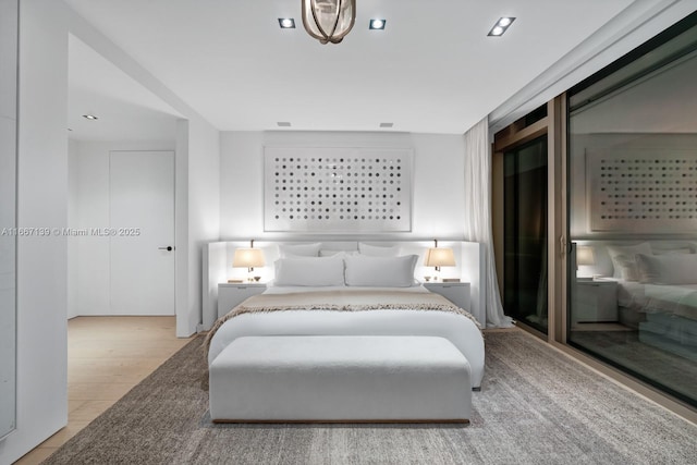 bedroom with light wood-type flooring