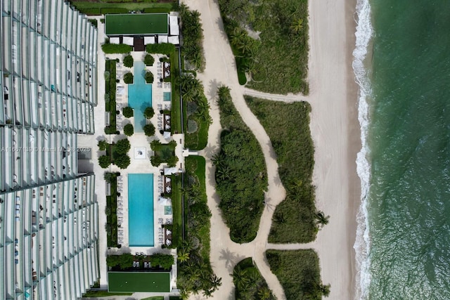 drone / aerial view with a water view and a view of the beach