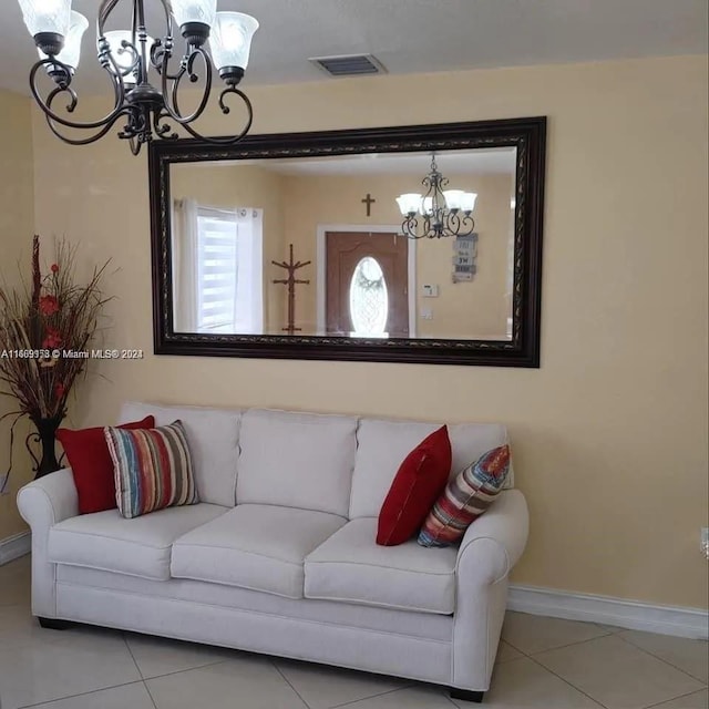 441 E 37th St, Hialeah, FL 33013 - living room featuring a chandelier and tile patterned floors