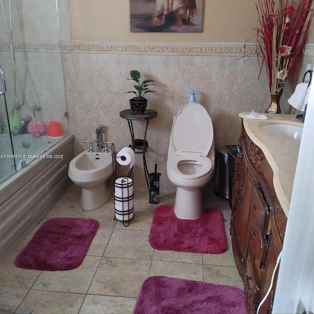 441 E 37th St, Hialeah, FL 33013 - full bath with enclosed tub / shower combo, a bidet, vanity, tile walls, and tile patterned floors