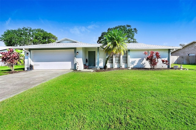 ranch-style house with a front yard and a garage