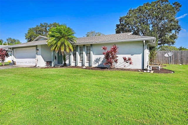 single story home with a front yard and a garage