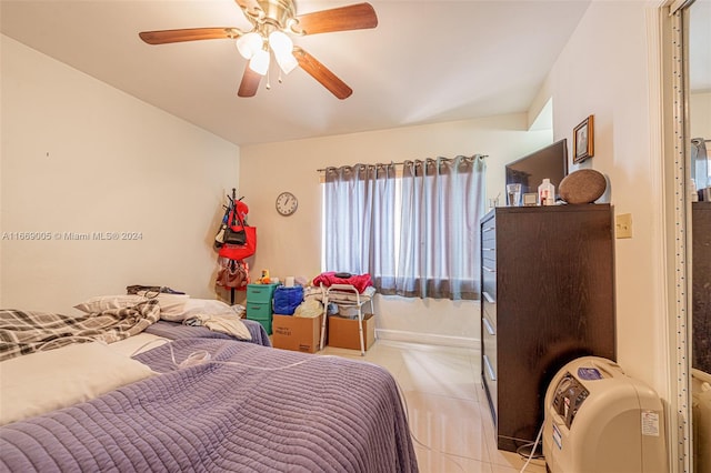 bedroom featuring ceiling fan and light tile patterned floors