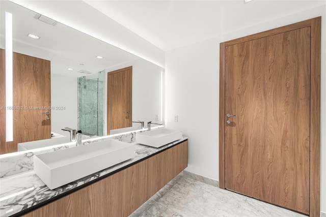 bathroom with vanity and a shower with shower door