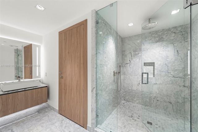 bathroom featuring vanity and a shower with shower door