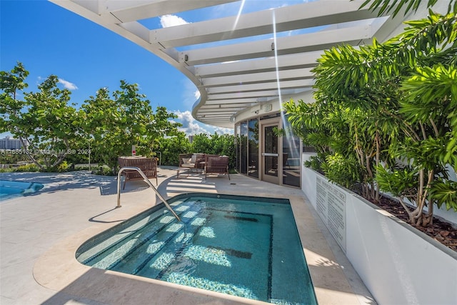 view of pool with a pergola, an outdoor hangout area, and a patio