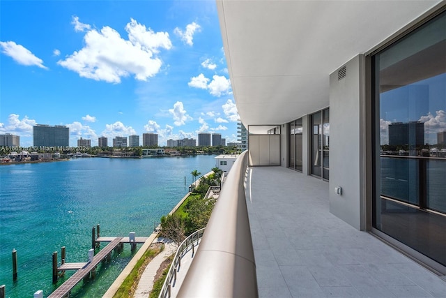 balcony featuring a water view