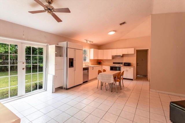 kitchen with visible vents, paneled built in refrigerator, white electric range, stainless steel dishwasher, and light tile patterned flooring