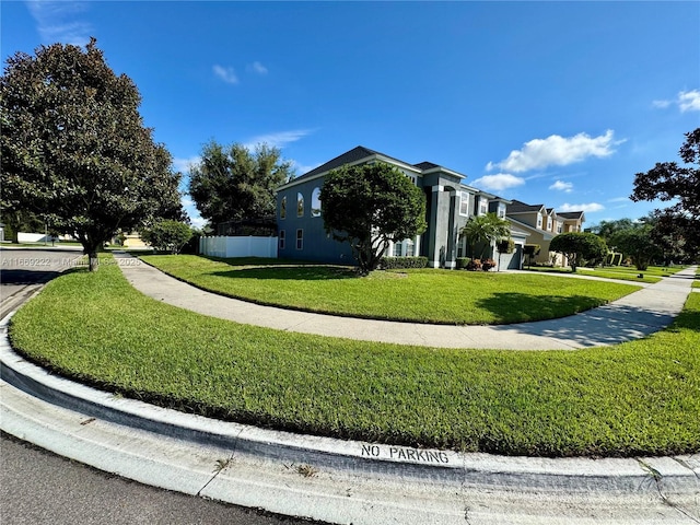 view of property exterior featuring a lawn