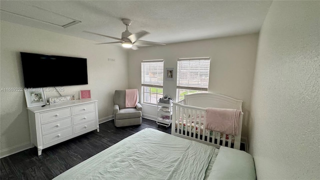 bedroom featuring ceiling fan and dark hardwood / wood-style flooring