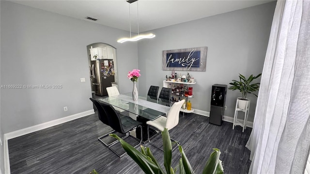 dining space featuring dark hardwood / wood-style flooring