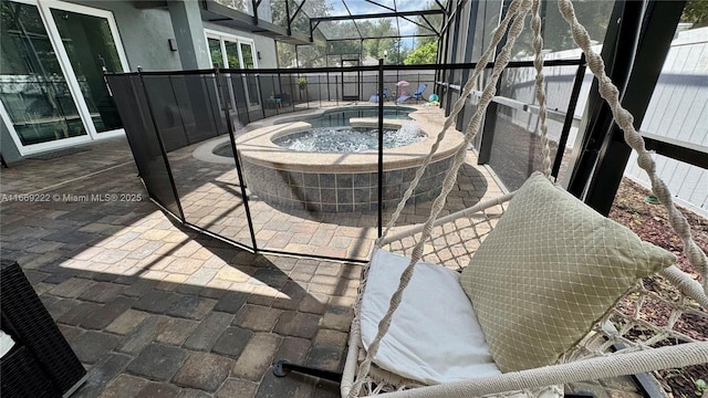 view of patio / terrace featuring a lanai