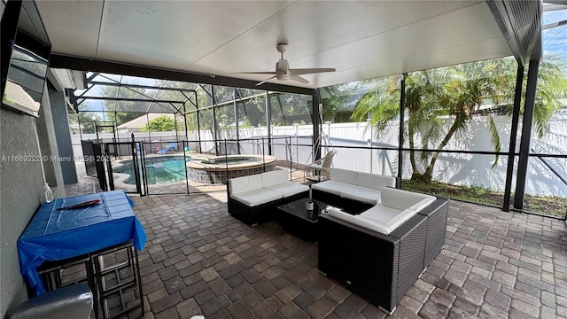 sunroom with ceiling fan and a swimming pool