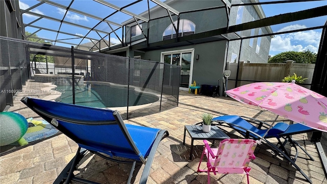 exterior space featuring a lanai and a fenced in pool