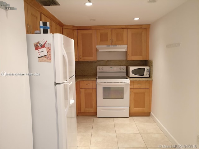 kitchen with white appliances, light tile patterned flooring, and backsplash